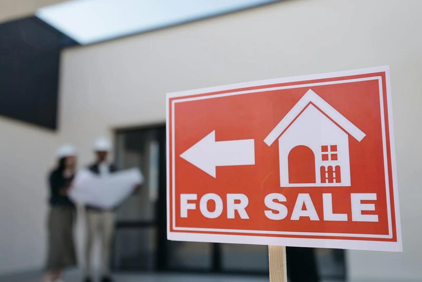 A 'For Sale' sign outside a house